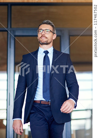 Businessman, walking and office building as corporate owner for startup, confidence or workspace. Male person, professional and real estate agent or entrepreneur with pride, outdoor or investment Businessman, walking and office building as corporate owner for startup, confidence or workspace. Male person, professional and real estate agent or entrepreneur with pride, outdoor or investment 117467502