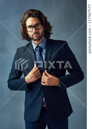 Fashion, portrait and suit with business man in studio on gray wall background for professional career. Corporate, formal jacket and style with smart employee or in work outfit for elegance or power Fashion, portrait and suit with business man in studio on gray wall background for professional career. Corporate, formal jacket and style with smart employee or in work outfit for elegance or power 117467577