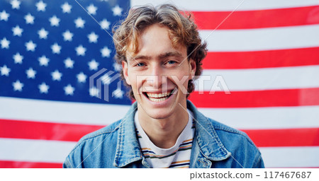 Funny, patriotism and portrait with man on american flag for democracy, freedom or home of brave. Culture, history or tradition and smile of person on stars and stripes for July 4 celebration in USA Funny, patriotism and portrait with man on american flag for democracy, freedom or home of brave. Culture, history or tradition and smile of person on stars and stripes for July 4 celebration in USA 117467687