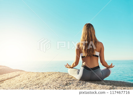 Outdoor, back and woman with chakra for yoga, wellness and spiritual peace in California. Zen, female yogi and hands with lotus pose for meditation, relax and mental health on beach by mockup space Outdoor, back and woman with chakra for yoga, wellness and spiritual peace in California. Zen, female yogi and hands with lotus pose for meditation, relax and mental health on beach by mockup space 117467716