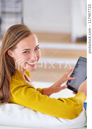 Portrait, happy and woman with tablet in living room for relax, social media or communication in home. Smile, technology and face of female person for internet search, networking or news article 117467720