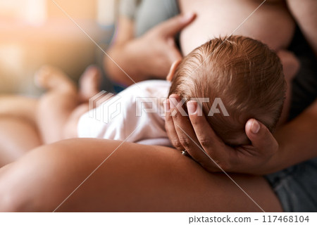 Mother, baby and breastfeeding with love in bedroom for growth development, nutrition or digestive health. Lens flare, care and woman with newborn child for natural milk, wellness or bonding in home Mother, baby and breastfeeding with love in bedroom for growth development, nutrition or digestive health. Lens flare, care and woman with newborn child for natural milk, wellness or bonding in home 117468104