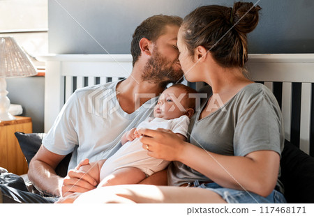 Parents, people and baby for kiss in home, love and affection with newborn in bedroom for relationship bonding. Parenthood, care and apartment with family together, happiness and trust or support 117468171