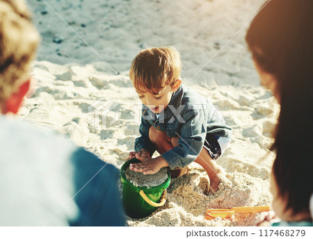 Play, beach and boy with parents, sand and sunshine with vacation, getaway trip and bonding together. Happy family, mother and father with son, seaside and toys with holiday, summer and weekend break Play, beach and boy with parents, sand and sunshine with vacation, getaway trip and bonding together. Happy family, mother and father with son, seaside and toys with holiday, summer and weekend break 117468279