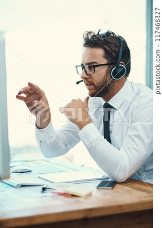 Business, man and call center with headset on computer, help desk and customer service or online advice. Tech support, sales and network with microphone for communication, agent and consultation 117468327