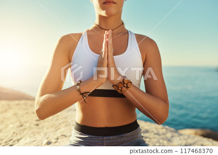 Outdoor, namaste and woman with zen for yoga, wellness and spiritual peace in California. Chakra, female yogi and prayer hands with meditation for wellbeing, relax and mental health by rock in ocean Outdoor, namaste and woman with zen for yoga, wellness and spiritual peace in California. Chakra, female yogi and prayer hands with meditation for wellbeing, relax and mental health by rock in ocean 117468370