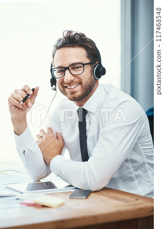Businessman, portrait and call center office with headset, help desk and friendly customer service for online advice. Tech support, telesales and communication, agent and consultation professional 117468548