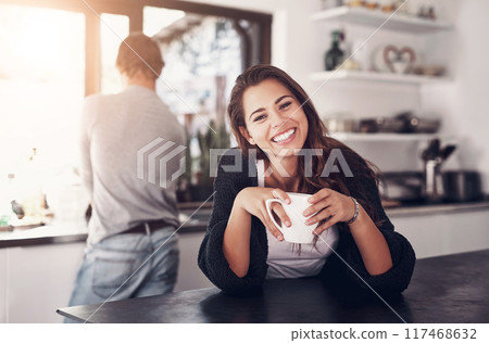 Happy woman, coffee and portrait in kitchen with man, relax and comfort in house on vacation. Female person, smile and beverage on holiday with partner, leisure and enjoyment together in Spain Happy woman, coffee and portrait in kitchen with man, relax and comfort in house on vacation. Female person, smile and beverage on holiday with partner, leisure and enjoyment together in Spain 117468632