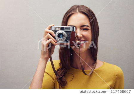 Woman, portrait and vintage camera with photographer in studio with smile, lens and retro with artist. Happiness, aesthetic and professional journalist for newspaper company with elections in America 117468667