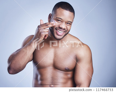 Black man, apply spf and portrait in studio for skincare, ointment and cosmetics on blue background. Person, lotion and pamper for dermatology, grooming and cream for hydration or skin treatment Black man, apply spf and portrait in studio for skincare, ointment and cosmetics on blue background. Person, lotion and pamper for dermatology, grooming and cream for hydration or skin treatment 117468733