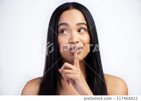 Woman, quiet and secret for hair care in studio with salon aesthetic and healthy scalp for growth. Model girl, keratin shine and silence emoji with thinking for texture ideas by white background Woman, quiet and secret for hair care in studio with salon aesthetic and healthy scalp for growth. Model girl, keratin shine and silence emoji with thinking for texture ideas by white background 117468822