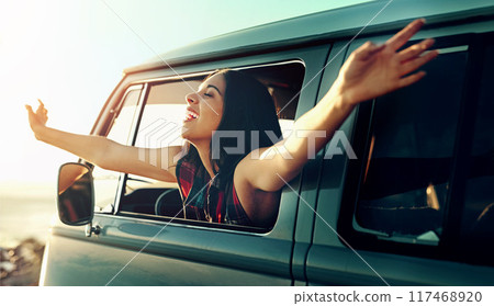 Road trip, woman and freedom in car with laugh, van and travel for holiday and vacation. Transport, parking and adventure with smile and motor window in summer with driving and journey with driver 117468920