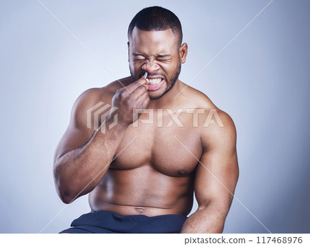 Black man, tweezers and nose hair in studio, grooming and plucking for epilation on blue background. Male person, skincare and maintenance for hygiene routine or cleaning, beauty and facial cosmetics Black man, tweezers and nose hair in studio, grooming and plucking for epilation on blue background. Male person, skincare and maintenance for hygiene routine or cleaning, beauty and facial cosmetics 117468976