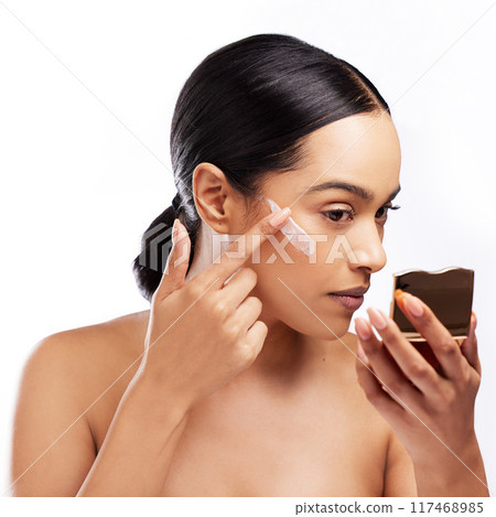 Mirror, woman and skincare or cream in studio for hydration, wellness and beauty product. Sunscreen, model girl and application in morning for summer isolated by white background with self care Mirror, woman and skincare or cream in studio for hydration, wellness and beauty product. Sunscreen, model girl and application in morning for summer isolated by white background with self care 117468985