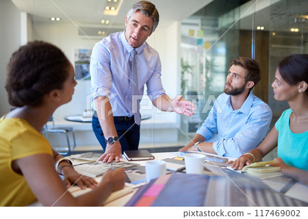 Businessman, staff and talking in meeting office for planning, ideas and collaboration support of project pitch. Men, woman and discussion for brainstorming, feedback or teamwork with goals and trust 117469002