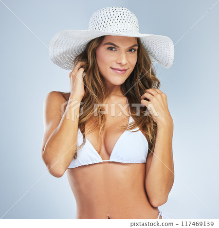 Woman, bikini and portrait in studio for confidence, fashion and beach body with summer in vacation. Female person, swimsuit and happy on white background for health, wellness and holiday with smile 117469139