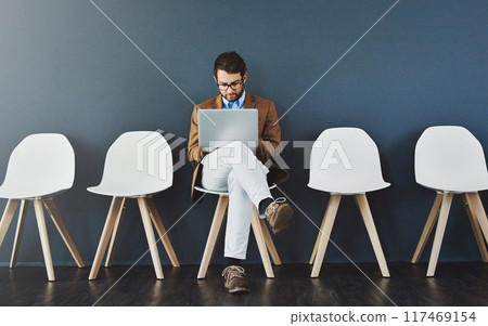 Job search, businessman and waiting room for interview with laptop, hiring or recruitment for internship. Man, position and vacancy for employment or human resources with difference, career or hr Job search, businessman and waiting room for interview with laptop, hiring or recruitment for internship. Man, position and vacancy for employment or human resources with difference, career or hr 117469154