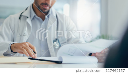 Hands, doctor and patient with consultation, documents and conversation for wellness, insurance and healthcare. Closeup, people and medical with professional, paperwork and discussion for results 117469157