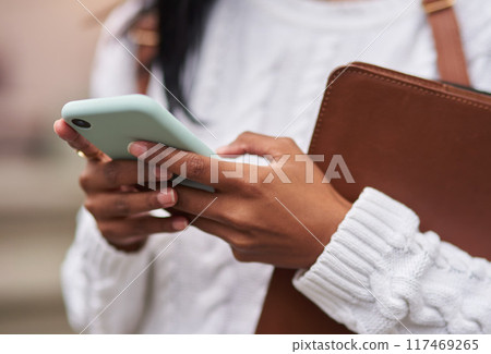 Outdoor, phone and hands of student, girl and research for studying, online and internet on app. Scholarship, university and person in campus with social media, reading news for school or college 117469265