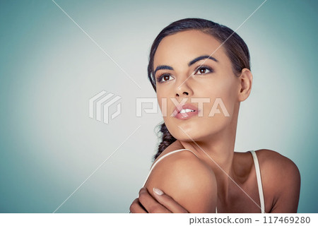 Glow, mockup or woman thinking of beauty or skincare on blue background for shine, person or natural glow. Model, face or proud girl in studio for dermatology space, smooth results or facial health 117469280