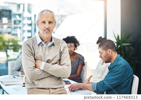 Mature businessman, executive and arms crossed for meeting in office with confidence in corporate planning. Professional, ceo or expert with pride in boardroom for teamwork, project strategy or ideas 117469313