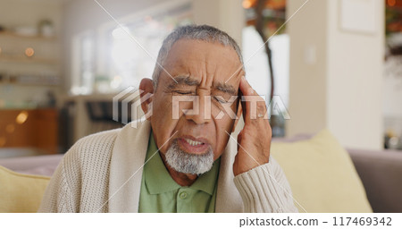 Home, senior man and headache on couch for stress, emotional distress and temporal vertigo. Living room, sofa and old person with pain, migraine and anxiety for overthinking in retirement in house 117469342