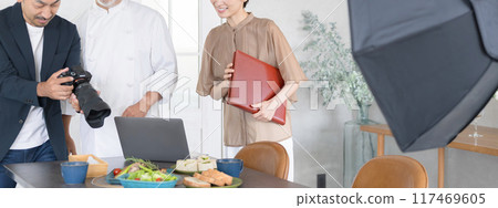 Photographer, chef and director taking pictures of food Banner without faces Photographer, chef and director taking pictures of food Banner without faces 117469605