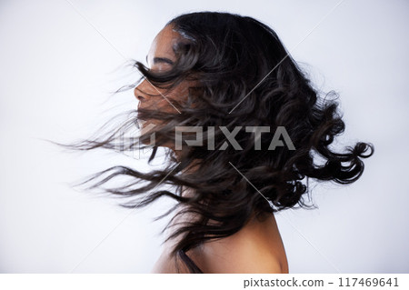 Woman, shaking and hair beauty in studio with luxury keratin treatment, volume and texture shine for growth health. Female person, hairdresser and collagen benefits, cosmetics and white background 117469641