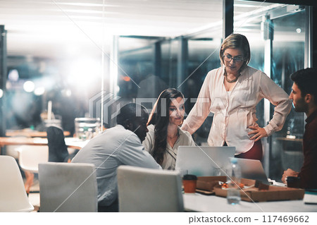 Night, management and creative people with laptop in meeting for creative project, review and feedback. Web design, team and employees with mentor in office for ux information, deadline and overtime 117469662