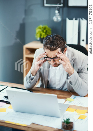 Laptop, glasses and businessman with pain in office for tension, headache and anxiety in finance job. Top view, broker and frustrated with stress by tech for investment, mistake or stock market crash Laptop, glasses and businessman with pain in office for tension, headache and anxiety in finance job. Top view, broker and frustrated with stress by tech for investment, mistake or stock market crash 117470101
