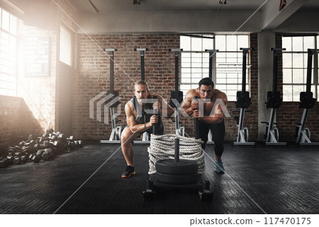 Athletes, training or pushing weights in gym together for teamwork, practice or group sports. Strong, men or friends exercise in fitness centre for cardio class, physical activity and calisthenics 117470175