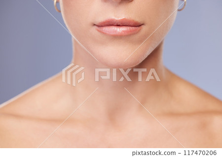 Woman, lips and skincare in studio for shine, facial treatment and cosmetics on blue background. Female person, mouth and pamper for dermatology, grooming and confident for soft skin or wellness Woman, lips and skincare in studio for shine, facial treatment and cosmetics on blue background. Female person, mouth and pamper for dermatology, grooming and confident for soft skin or wellness 117470206