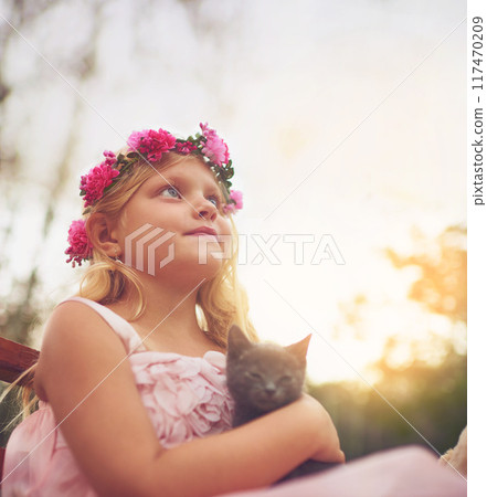 Girl, relax and thinking with kitten for love or furry companion for comfort, friendship and growth or development. Kid, flower crown and cute animal in nature with affection, bonding and playing. 117470209