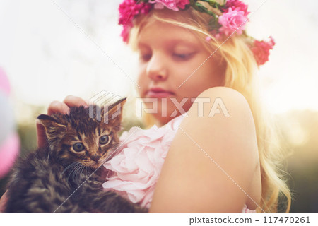 Girl, care and garden with kitten for love or furry companion for comfort, friendship and growth or development. Kid, flower crown and cute animal in nature with affection, bonding and playing. Girl, care and garden with kitten for love or furry companion for comfort, friendship and growth or development. Kid, flower crown and cute animal in nature with affection, bonding and playing. 117470261
