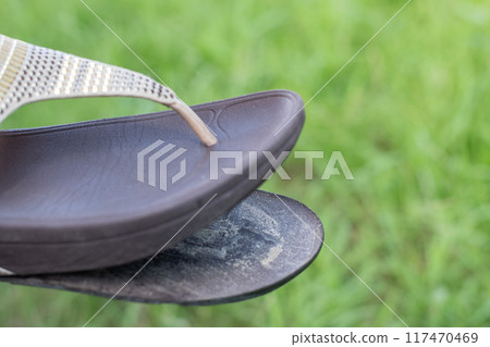 Sandals with torn soles 117470469