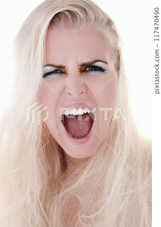 Portrait, screaming and angry woman in studio for makeup, frustrated and rage for cosmetics. Model girl, shouting and crazy for aesthetic, stress and transformation or insecurity by white background 117470490