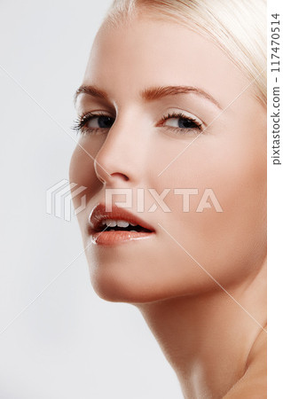 Woman, glow and skincare in studio portrait, foundation and makeup treatment on white background. Female person, dermatology and confidence for shine, smooth skin and facial wellness for cosmetics Woman, glow and skincare in studio portrait, foundation and makeup treatment on white background. Female person, dermatology and confidence for shine, smooth skin and facial wellness for cosmetics 117470514