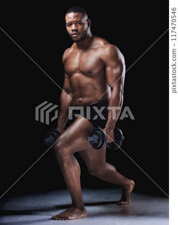 Fitness, portrait and black man in studio with dumbbells for training, workout or weightlifting on dark background. Body, strong and bodybuilder with weights for muscle growth, wellness or squat 117470546