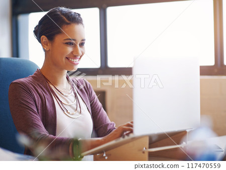 Woman, laptop and typing at startup with smile for inspiration, ideas and email at media company. Person, writer and computer in modern office for reading, feedback and review at creative agency Woman, laptop and typing at startup with smile for inspiration, ideas and email at media company. Person, writer and computer in modern office for reading, feedback and review at creative agency 117470559