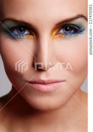 Woman, beauty and eyeshadow in studio, portrait and cosmetics for makeup or confident. Female person, color and creative skincare or foundation, art and eyebrow treatment or dermatology closeup Woman, beauty and eyeshadow in studio, portrait and cosmetics for makeup or confident. Female person, color and creative skincare or foundation, art and eyebrow treatment or dermatology closeup 117470561