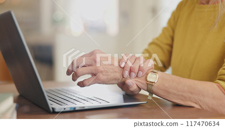 Arthritis, wrist pain and senior person with laptop after typing, browsing and scrolling in home. Desk, computer and hands with osteoporosis, bruise muscle and carpal tunnel as crisis in house Arthritis, wrist pain and senior person with laptop after typing, browsing and scrolling in home. Desk, computer and hands with osteoporosis, bruise muscle and carpal tunnel as crisis in house 117470634