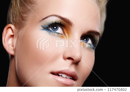 Woman, thinking and eyeshadow in studio, makeup and cosmetics for care on black background. Female person, color and creative skincare or foundation, art and eyebrow treatment or dermatology shine 117470802
