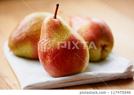 Home, fruits or healthy pears in kitchen for fiber, organic or balanced diet for nutrition, meal or snacks. Background, vegan or closeup of natural ingredients for vitamins, fresh produce or raw food Home, fruits or healthy pears in kitchen for fiber, organic or balanced diet for nutrition, meal or snacks. Background, vegan or closeup of natural ingredients for vitamins, fresh produce or raw food 117470846
