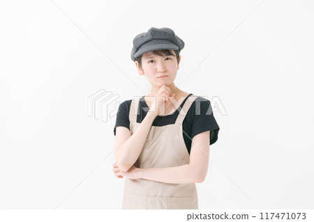 Cafe staff with a thinking expression Cafe staff with a thinking expression 117471073