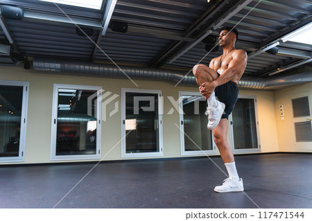 Young man warming up before martial arts practice 117471544