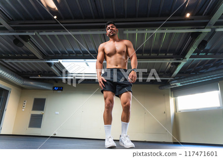 Shirtless latino male with muscular body at the gym 117471601