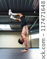 Young latino man with an athletic body doing a handstand 117471648