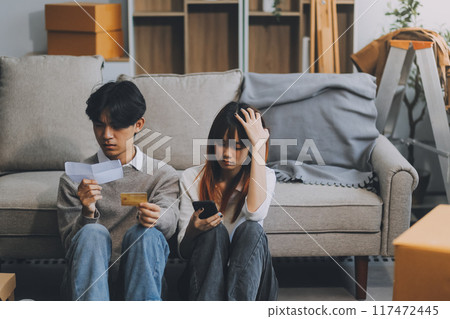 Worried annoyed young husband wife using phone credit card dissatisfied with interrupted wifi internet connection slow bad app work. Angry family couple bank clients unable to pay online check balance Worried annoyed young husband wife using phone credit card dissatisfied with interrupted wifi internet connection slow bad app work. Angry family couple bank clients unable to pay online check balance 117472445