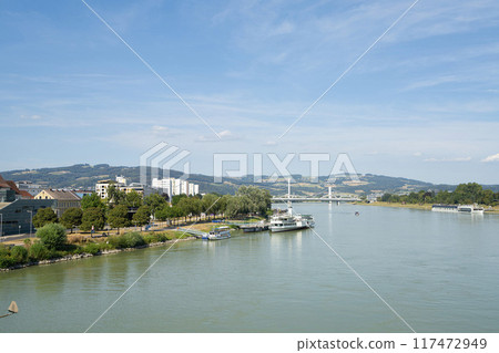 the banks of the Danube River in Linz, Austria 117472949