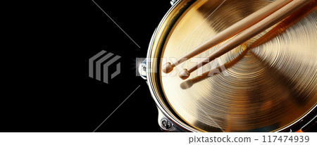 Two Wooden Drumsticks on a Snare Drum and Golden Cymbal - Generative Ai Two Wooden Drumsticks on a Snare Drum and Golden Cymbal - Generative Ai 117474939